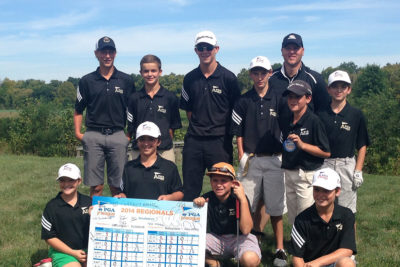 Youth Team on golf course with score card